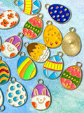 easter egg eggs gold tone metal enamel enamelled charm charms pendant spring springtime cute kawaii craft shop supplies uk bright colourful pink yellow chick bunny blue green orange teal turquoise white floral flowers striped stripes
