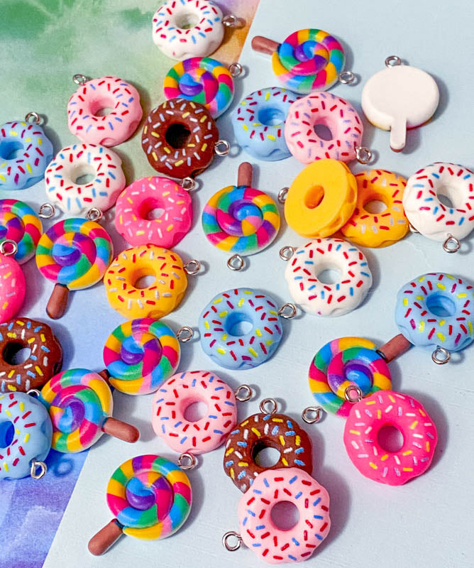 lollipop lolly rainbow lollies donut donuts resin charm charms pendant cute kawaii craft supplies shop store uk bright colours coloured swirl candy pink cerise yellow blue white sprinkles hundreds and thousands doughnut pretty fun jewellery supplies