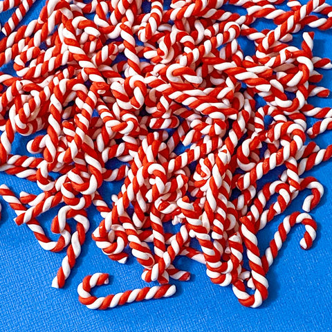 polymer clay candy cane handmade twist canes swirl sweets uk cute kawaii craft supplies fimo handmade embellishments festive red and white