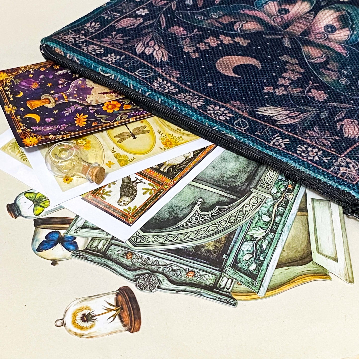 vintage botanical apothecary letterbox gift with canvas moth pouch, layered paper ephemera and animal and plant stickers with potion vial and cork stopper