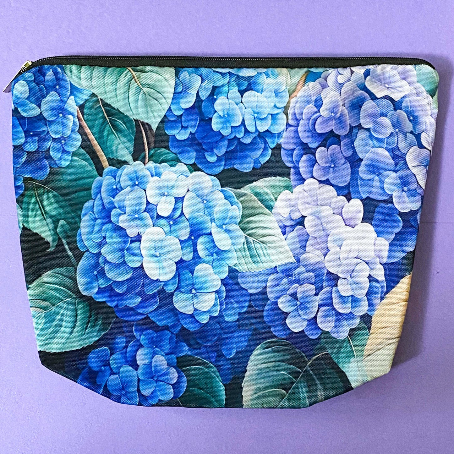 blue hydrangea letterbox gift set with canvas floral pouch, hydrangea black ink pen, enamel blue flower metal brooch, vintage botanical postcards and clear hydrangea stickers. uk cute gifts shop.