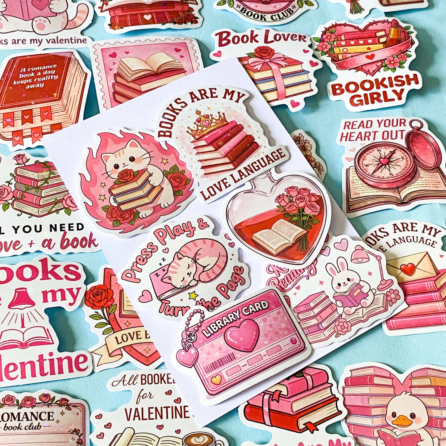 set of 52 stickers, book themed holographic stickers with pink and red designs featuring books, reading, animals , flowers and romantic bookish quotes