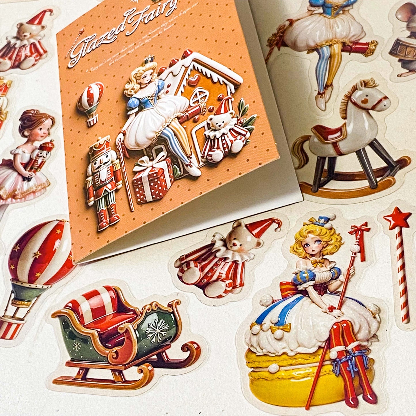 clara and the nutcracker suite clear PET large stickers with designs of toys including hot air balloon, doll, toy soldier, bear, rocking horse and mouse. Glazed effect so look like porcelain and glossy finish.