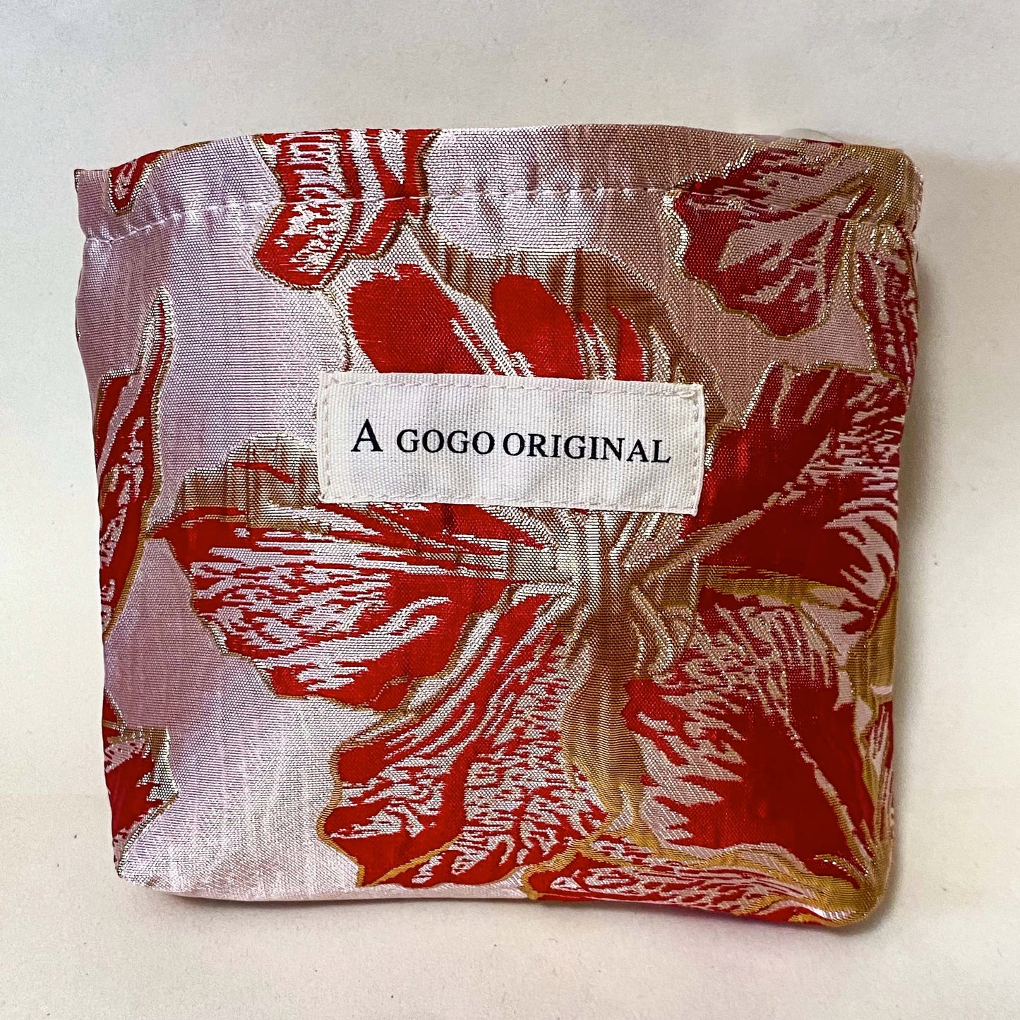 rose gold and crimson small floral bucket shaped lined satin fabric pouch for cosmetics or stationery. Metallic rich red and gold premium petite bag. Uk letterbox gifts.