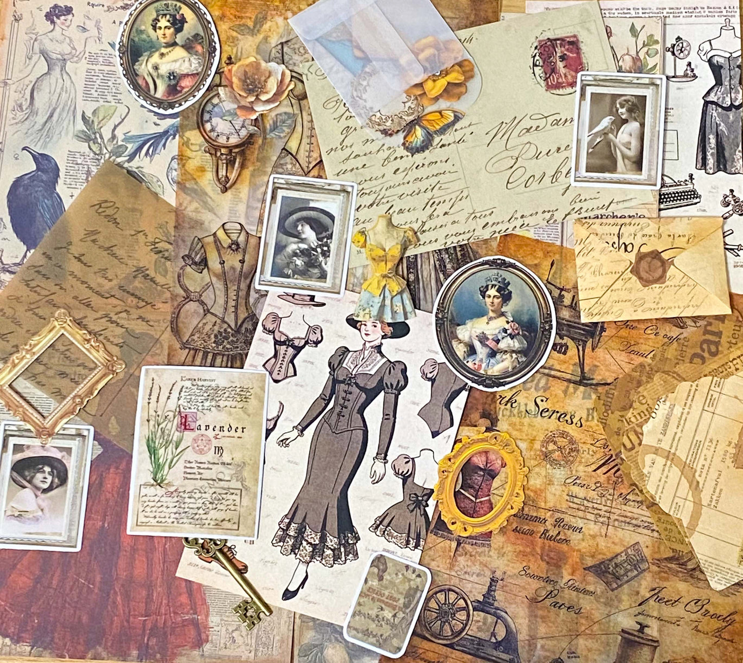 vintage scrapbooking ephemera bundle with victorian portrait stickers, antique papers, vellum sheets, mini envelopes and ornate key on neutral background