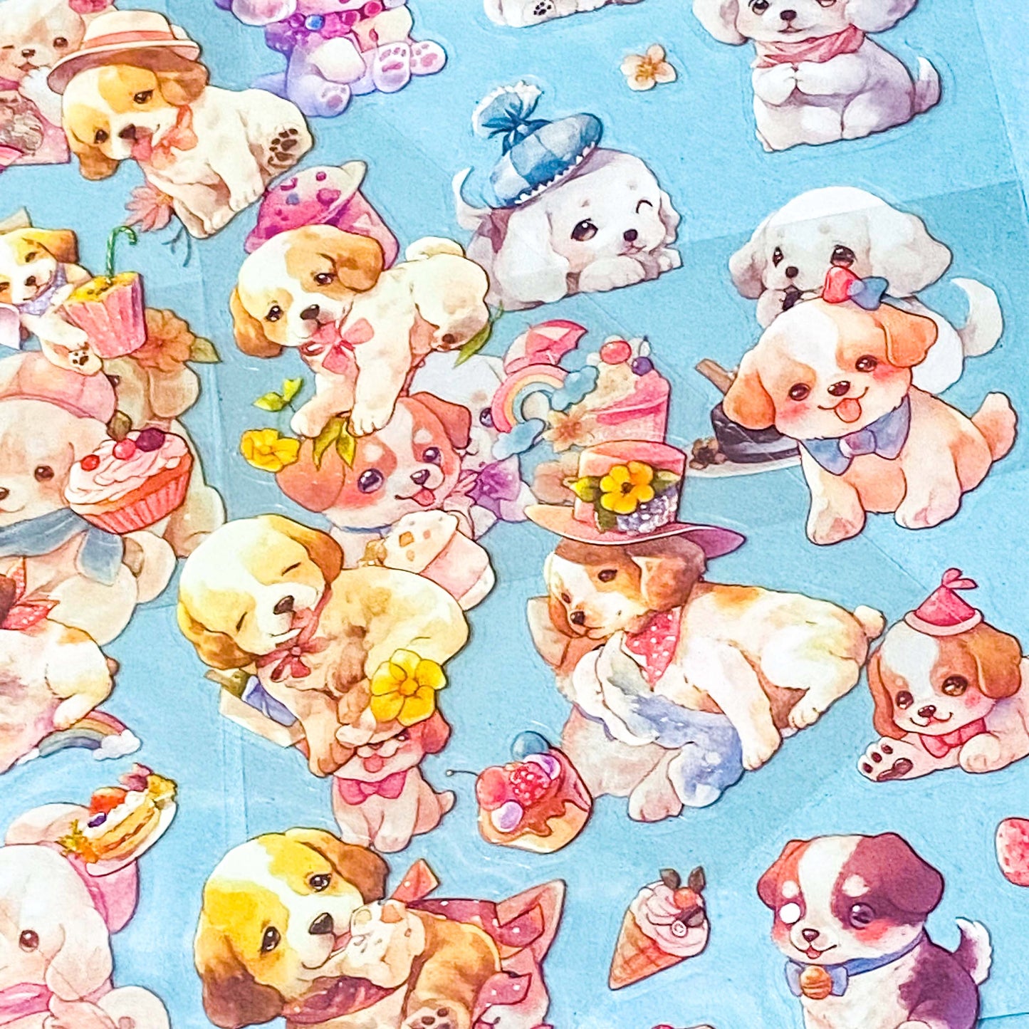 set of 6 kawaii puppy clear sticker sheets with pastel illustrations of cute dogs, desserts and accessories in a pink packet