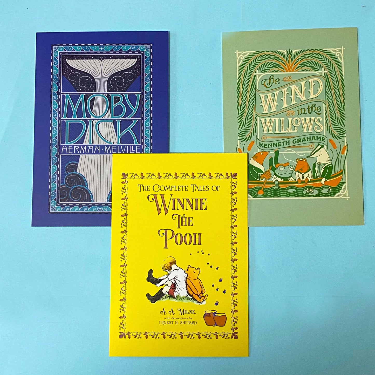 set of 3 vintage storybook cover postcards including winnie the pooh, moby dick and wind in the willows