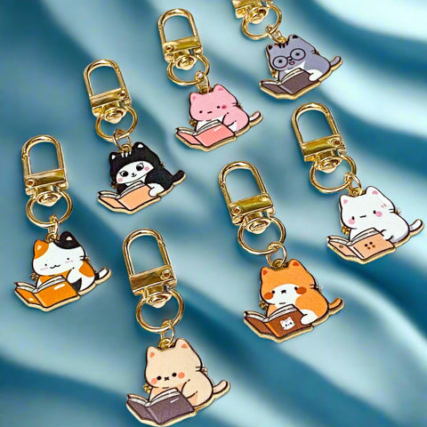 cat cats kitty kittens book reading books enamel charm charms clip clips cute kawaii key ring bag charm charms gold golden metal lovers gift gifts present pink grey tortoiseshell black white cream ginger uk