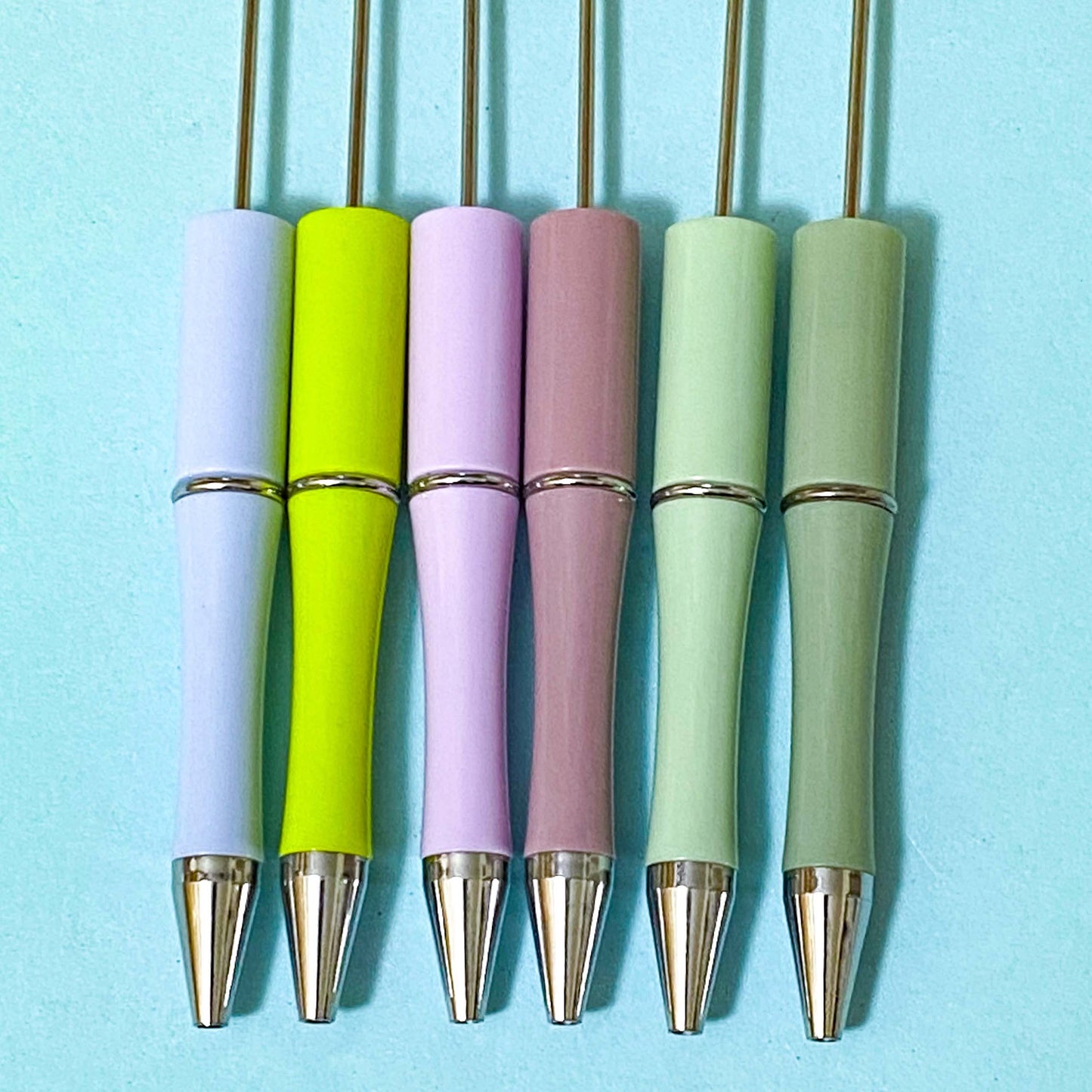 spring meadow pen bases in coordinated spring greens, lilac and plum tones with silver hardware