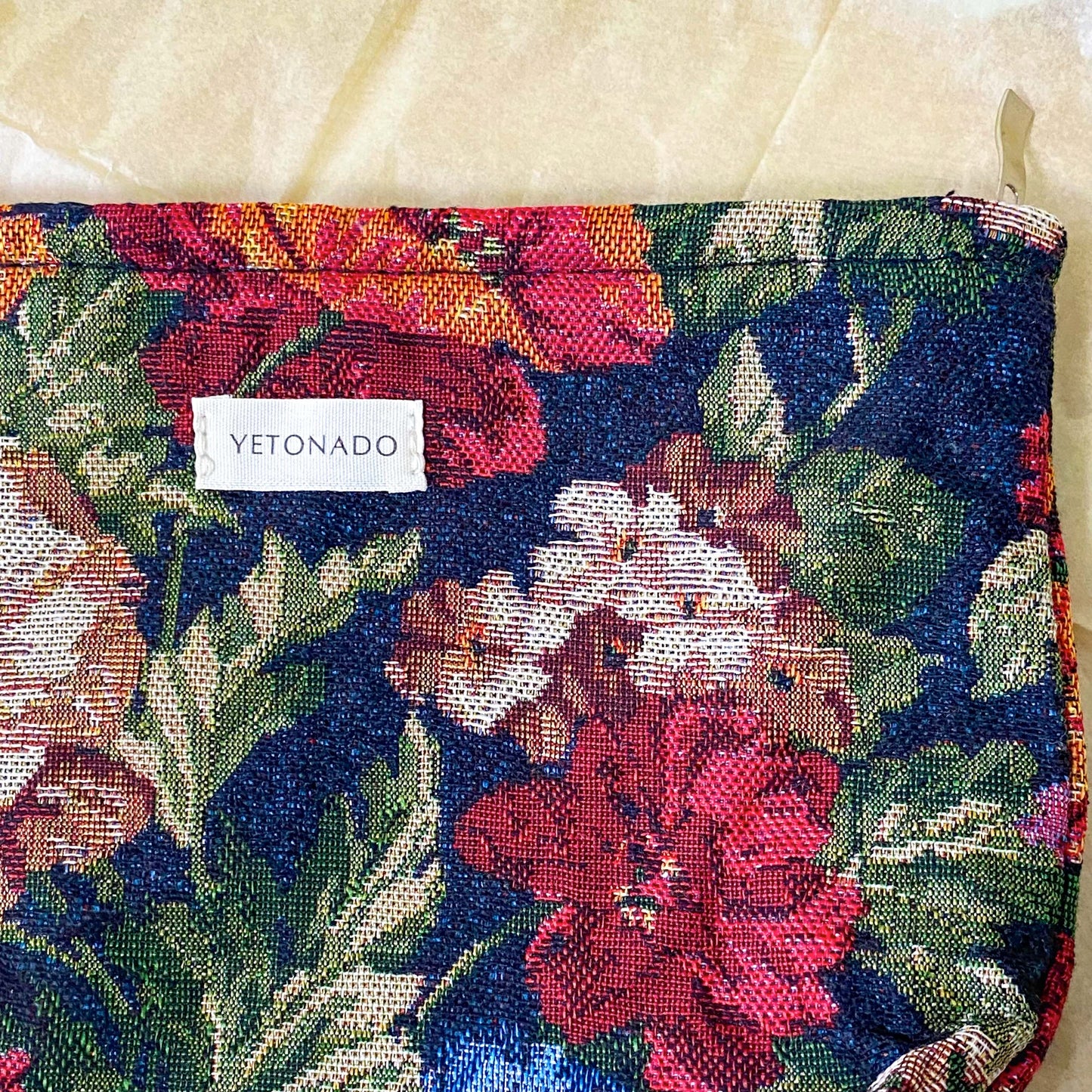 dark floral tapestry woven pouch with concealed zip fastening, lining and gusset. Large cosmetic bag with botanical design and textured fabric. manor garden.