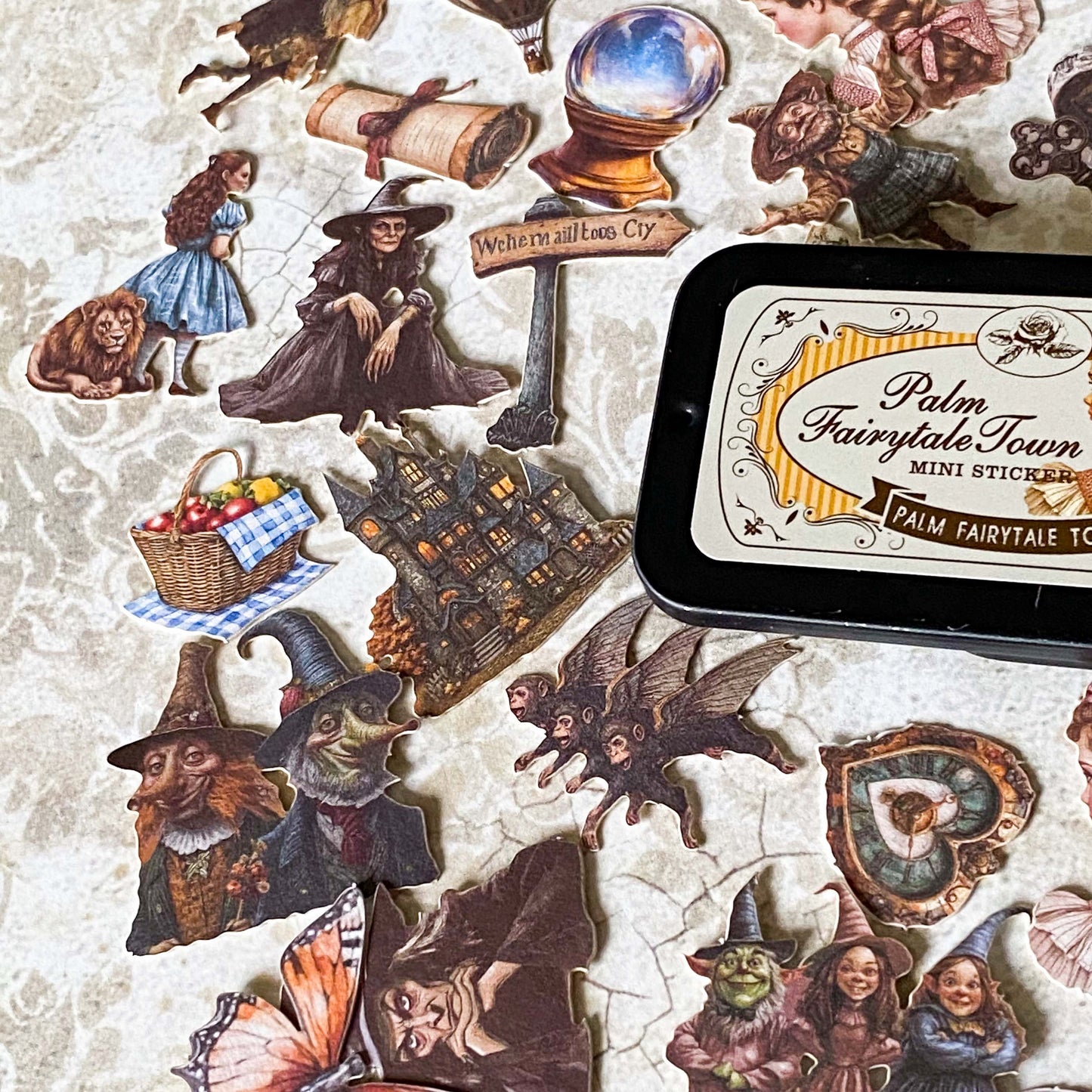 wizard of Oz card stickers in a mini tin featuring vintage style illustrations of dorothy, the lion, tin man and witch