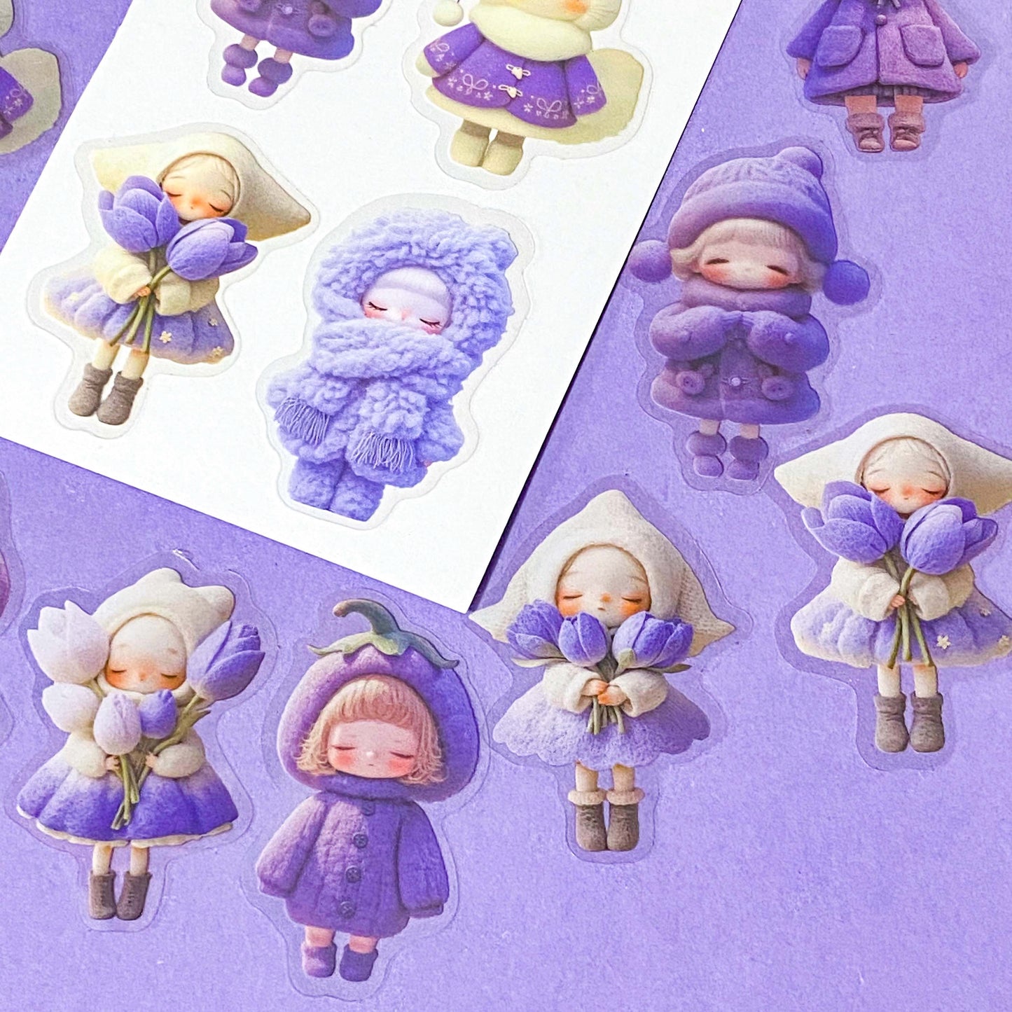 kawaii large PET lilac and purple doll stickers set of 20 with big colourful figures wearing winter clothing and holding spring flowers. Tulips, wooly hats and cat costumes. Cute stationery shop uk.