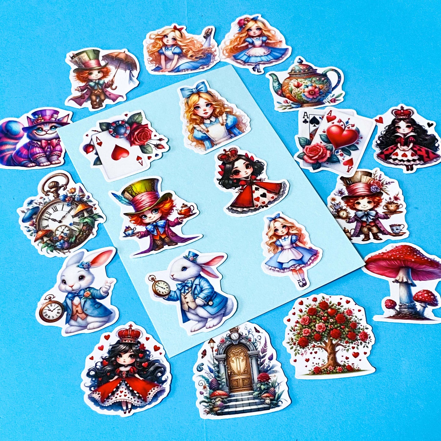 alice in wonderland inspired vinyl satin sticker set of 20 with cute kawaii illustrations featuring mad hatter, cartoon style red queen of hearts, pocket watch, white rabbit, cheshire cat, alice and playing card designs. UK cute stationery and sticker shop.