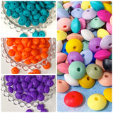 spacer spacers bean beans beads bead abacus disc thin silicone 12mm by 7mm flattened disk small soft uk cute kawaii craft supplies crafts shop store making beaded pen pens jewellery make bright strong orange deep purple dark green blue peacock teal 