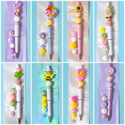 spring easter beaded pen kit with extra silicone beads refill and pen base on pretty blue background