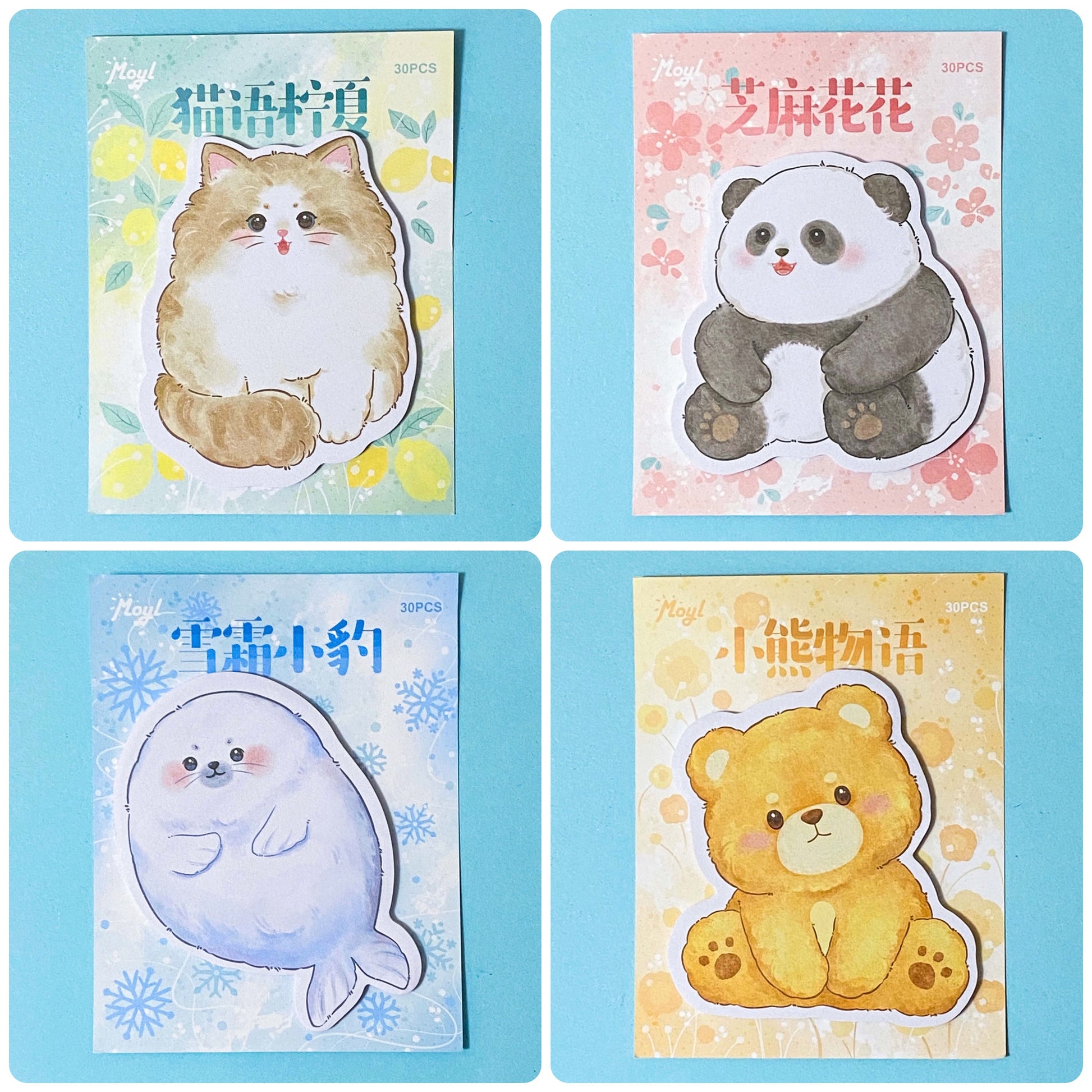 Set of four cute animal-themed sticky memo notes pad featuring a cat, panda, seal, and bear on a blue background.