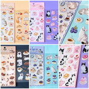 sticker packs of 2 clear PET sheets with cute cat stickers and edible cakes, sweets and treats. Cafe themed cats with tuxedo cat, siamese, grey tabby and ginger kittens. ute foods including fruit desserts.