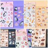 sticker packs of 2 clear PET sheets with cute cat stickers and edible cakes, sweets and treats. Cafe themed cats with tuxedo cat, siamese and ginger kittens.