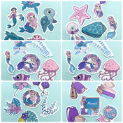 Collection of mermaid-themed laptop matte stickers on a light blue background