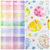bundle of easter and spring tissue paper with checked pastel pattern and eggs on white