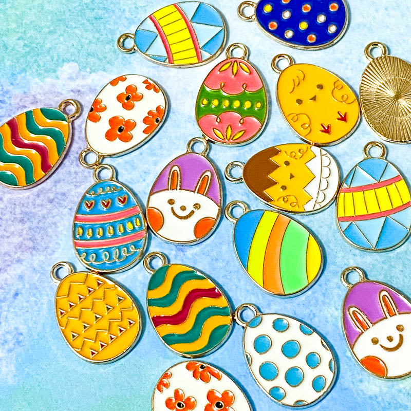 easter egg eggs gold tone metal enamel enamelled charm charms pendant spring springtime cute kawaii craft shop supplies uk bright colourful pink yellow chick bunny blue green orange teal turquoise white floral flowers striped stripes