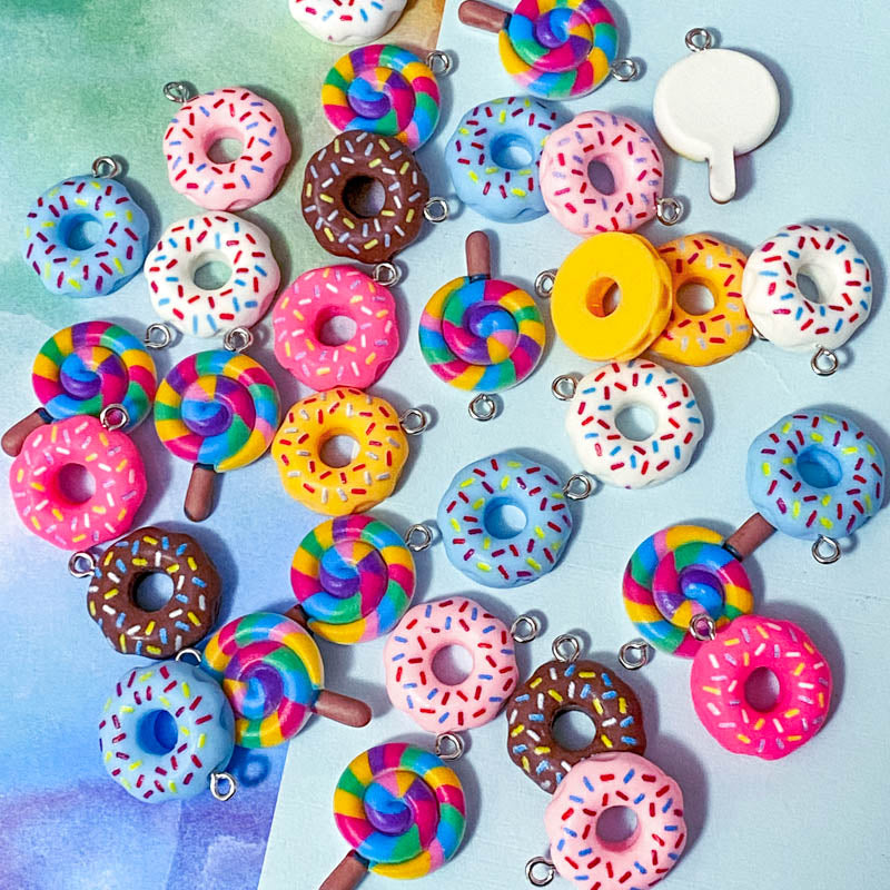 lollipop lolly rainbow lollies donut donuts resin charm charms pendant cute kawaii craft supplies shop store uk bright colours coloured swirl candy pink cerise yellow blue white sprinkles hundreds and thousands doughnut pretty fun jewellery supplies