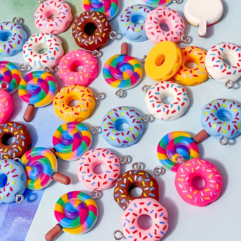 lollipop lolly rainbow lollies donut donuts resin charm charms pendant cute kawaii craft supplies shop store uk bright colours coloured swirl candy pink cerise yellow blue white sprinkles hundreds and thousands doughnut pretty fun jewellery supplies