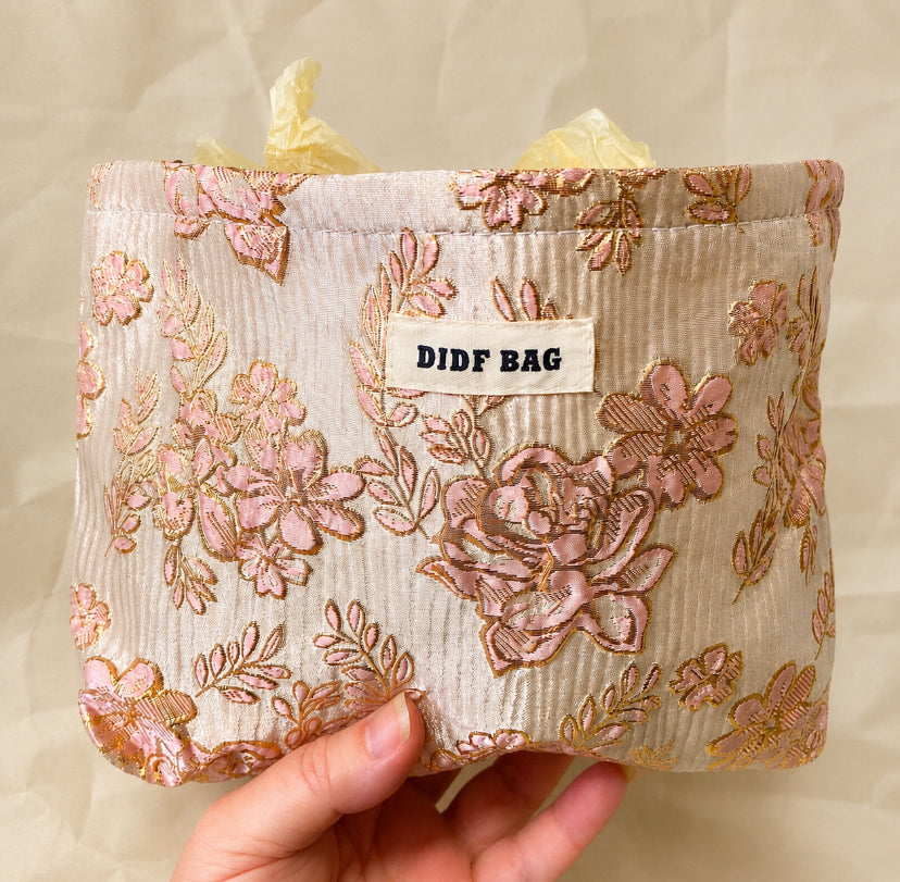 champagne satin fabric woven pouch with gold thread highlights and pink roses design. large cosmetic bag or journaling pouch. uk letterbox gifts