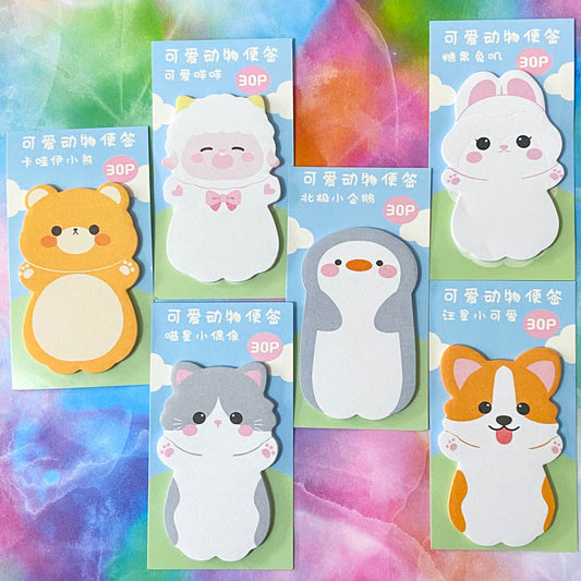 A collection of colorful sticky memo pads with cute animal designs, including a bear, cat, penguin, rabbit, and dog.