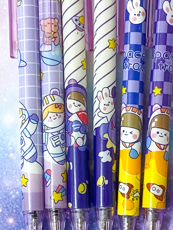 pastel lilac blue purple yellow galaxy starry sky pen pens space theme themed spaceman astronaut stars planet spaceship rocket rabbit bunny bear cat click fineline gel black ink uk cute kawaii stationery planner supplies gift gifts