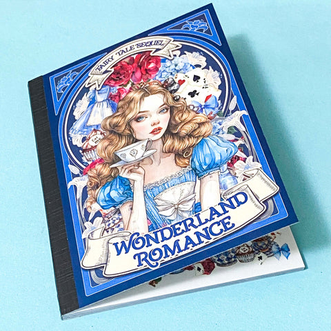'Wonderland Romance' sticker book folio with a decorative cover on a blue background.