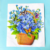 3d pop up card of a basket of blue forget me nots and butterflies on a blue background