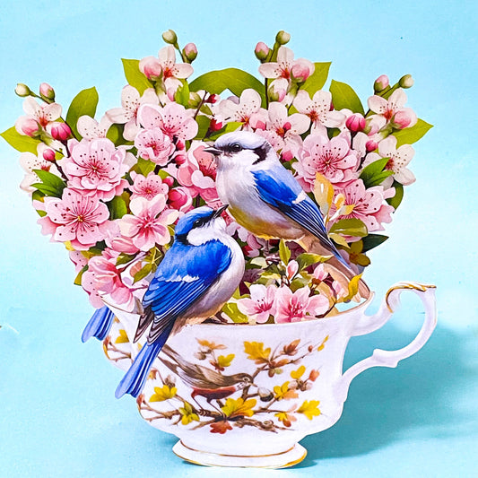 3d pop up card with a Teacup and floral design and blue birds on a light blue background
