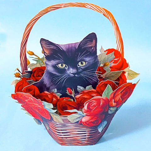 3d pop up card of a Cat sitting inside a basket of red roses on a blue background