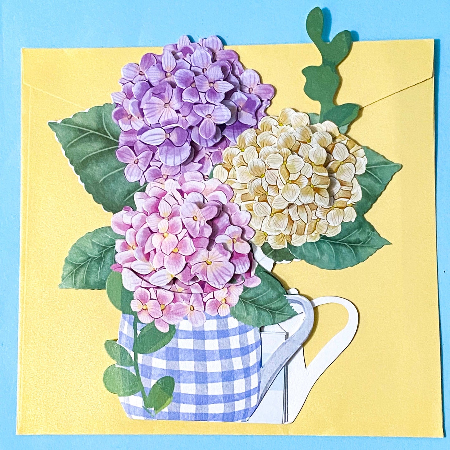 3d pop up floral card with hydrangeas in a blue gingham jug on a blue background