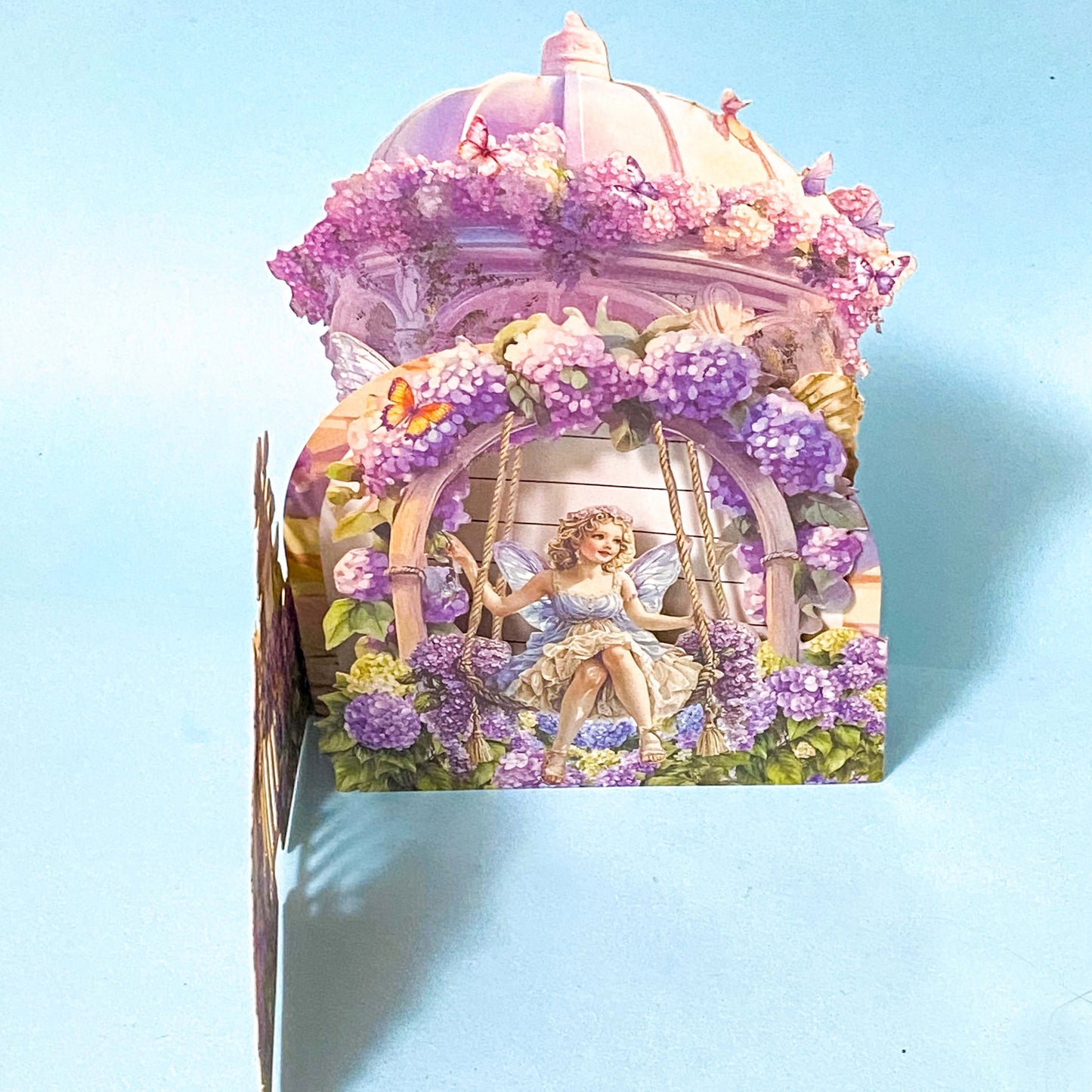 Decorative pop up 3d card with fairy and floral design on a blue background