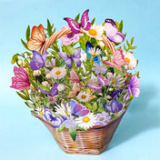 Decorative greeting card with a basket filled with flowers and butterflies on a blue background