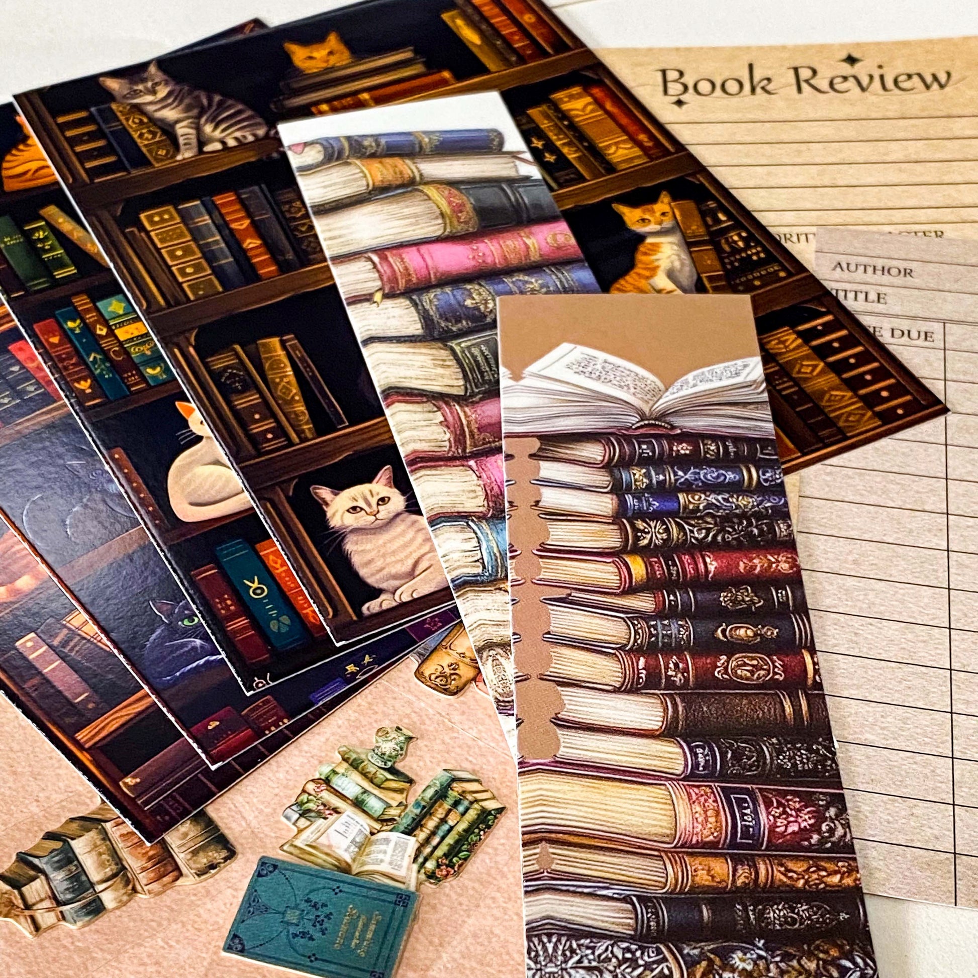 vintage book lover stationery set with cat library postcards, bookmarks, kraft book review card and book themed stickers arranged on kraft envelopes