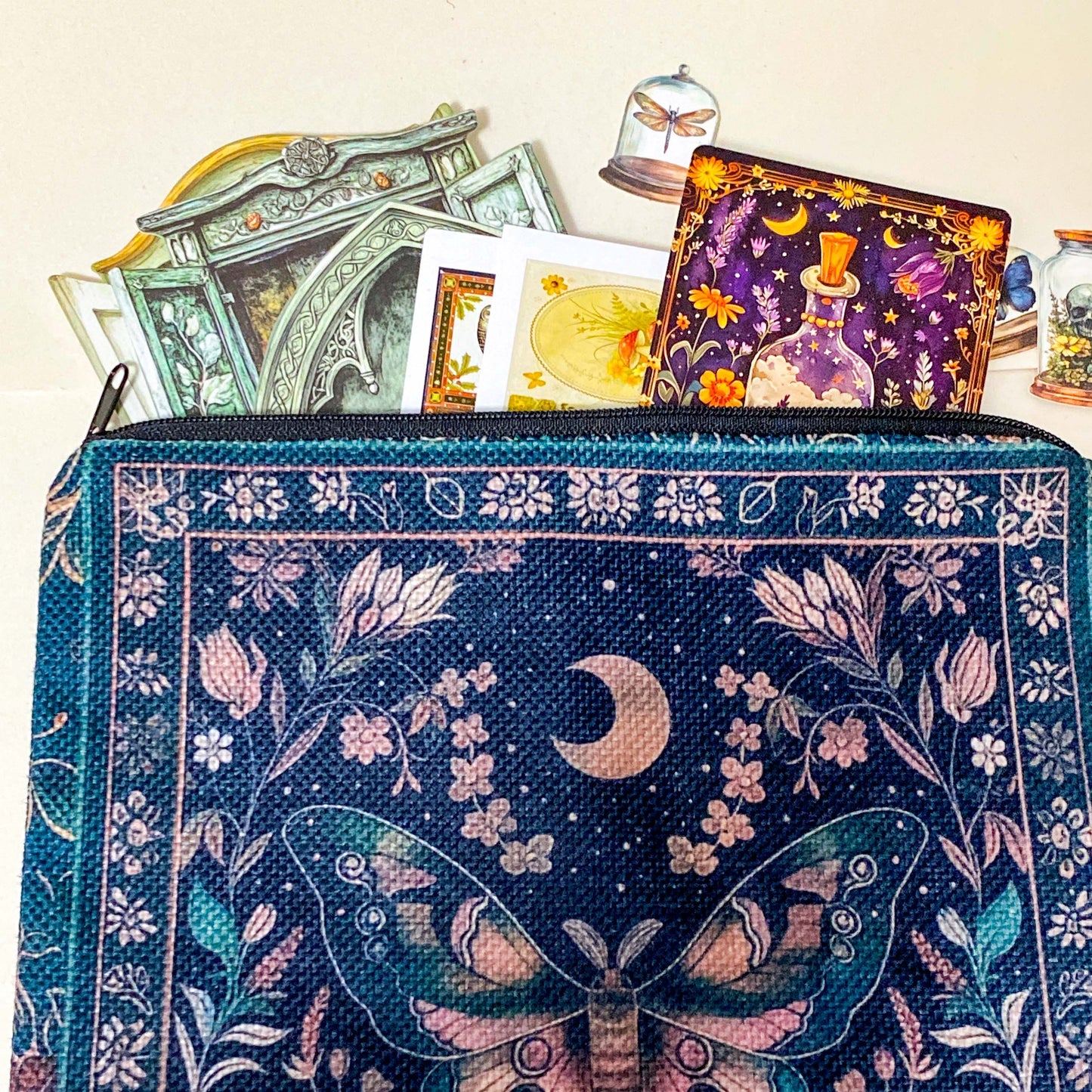 letterbox gift with a large canvas dark botanical pouch, cabinet ephemera kit, potion phial, stickers and oracle card