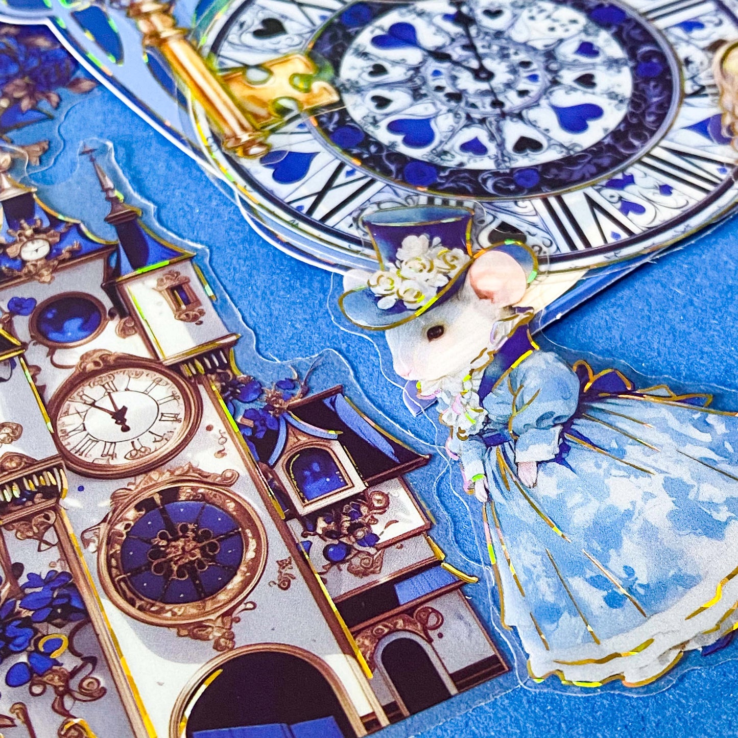 large blue alice in wonderland laser holo holographic plastic stickers featuring white rabbit, alice, clocks, teacups and fantasy illustrations