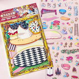 alice in wonderland sticker scene set with background card sheet and clear decorative stickers including teacup, playing cards and fantasy objects. activity creative set