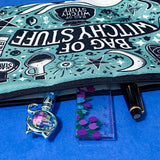 turquoise and black canvas zip pouch featuring the words "Bag of witchy stuff" surrounded by potion bottles, moons, stars, crystals and magical symbols. Uk cute and kawaii gifts shop. Bag for journaling, crystal storage or witchcraft supplies.