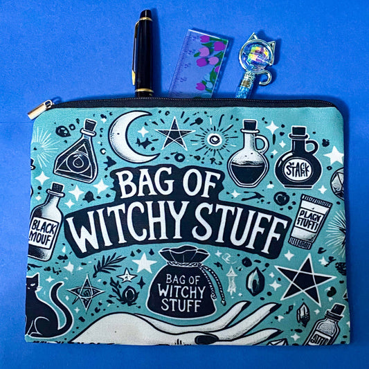 turquoise and black canvas zip pouch featuring the words "Bag of witchy stuff" surrounded by potion bottles, moons, stars, crystals and magical symbols. Uk cute and kawaii gifts shop. Bag for journaling, crystal storage or witchcraft supplies.