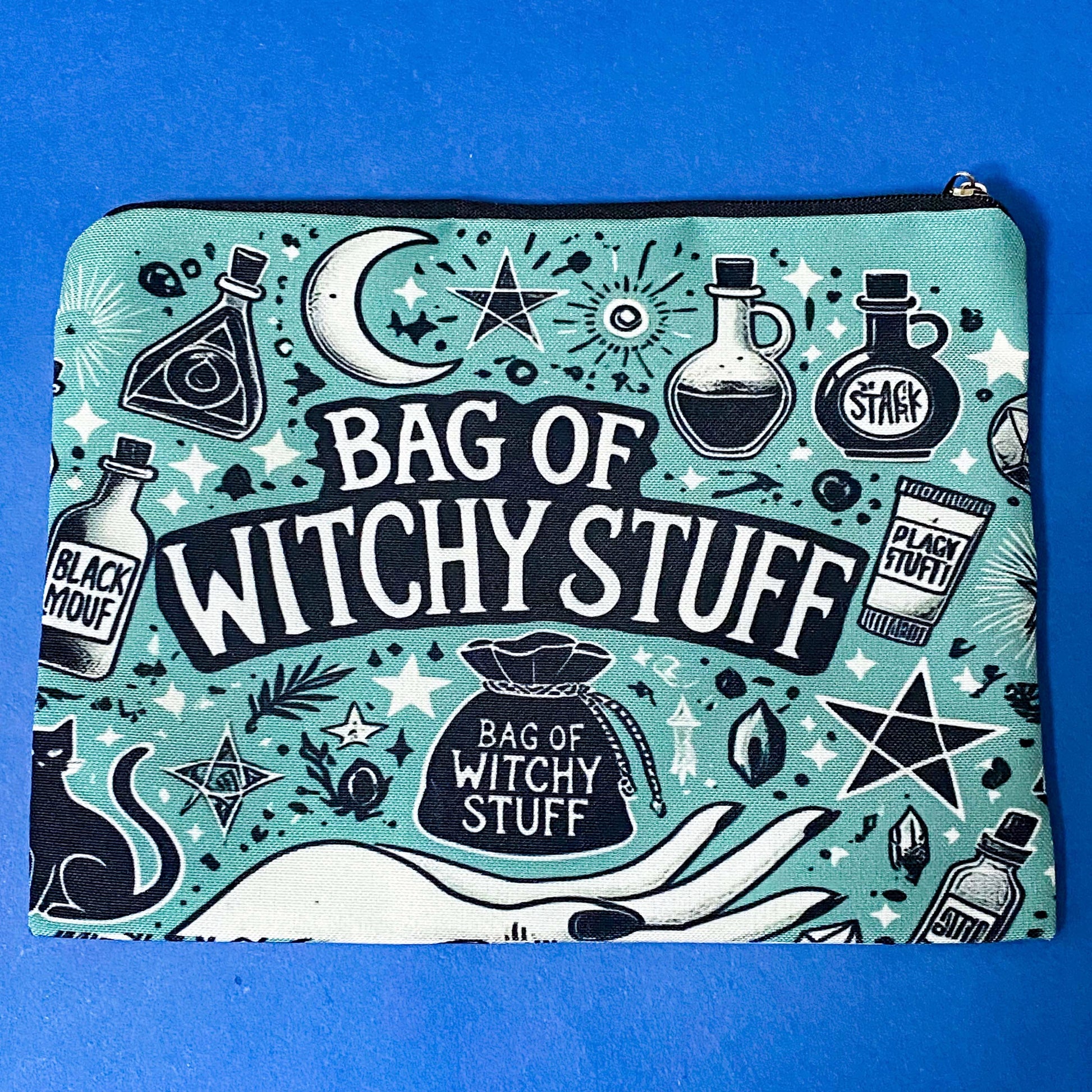 turquoise and black canvas zip pouch featuring the words "Bag of witchy stuff" surrounded by potion bottles, moons, stars, crystals and magical symbols. Uk cute and kawaii gifts shop. Bag for journaling, crystal storage or witchcraft supplies.