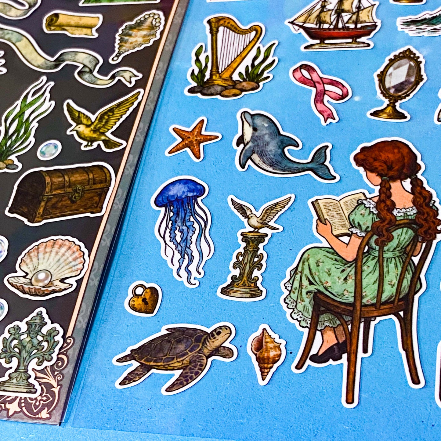 mermaid's secret cove little mermaid matte sticker pack with 2 decorative sheets featuring elegant mermaids, dolphins, whales, jellyfish, turtles, sailing ships, pearls, seashells and vintage ocean inspired illustrations Uk stationery shop.