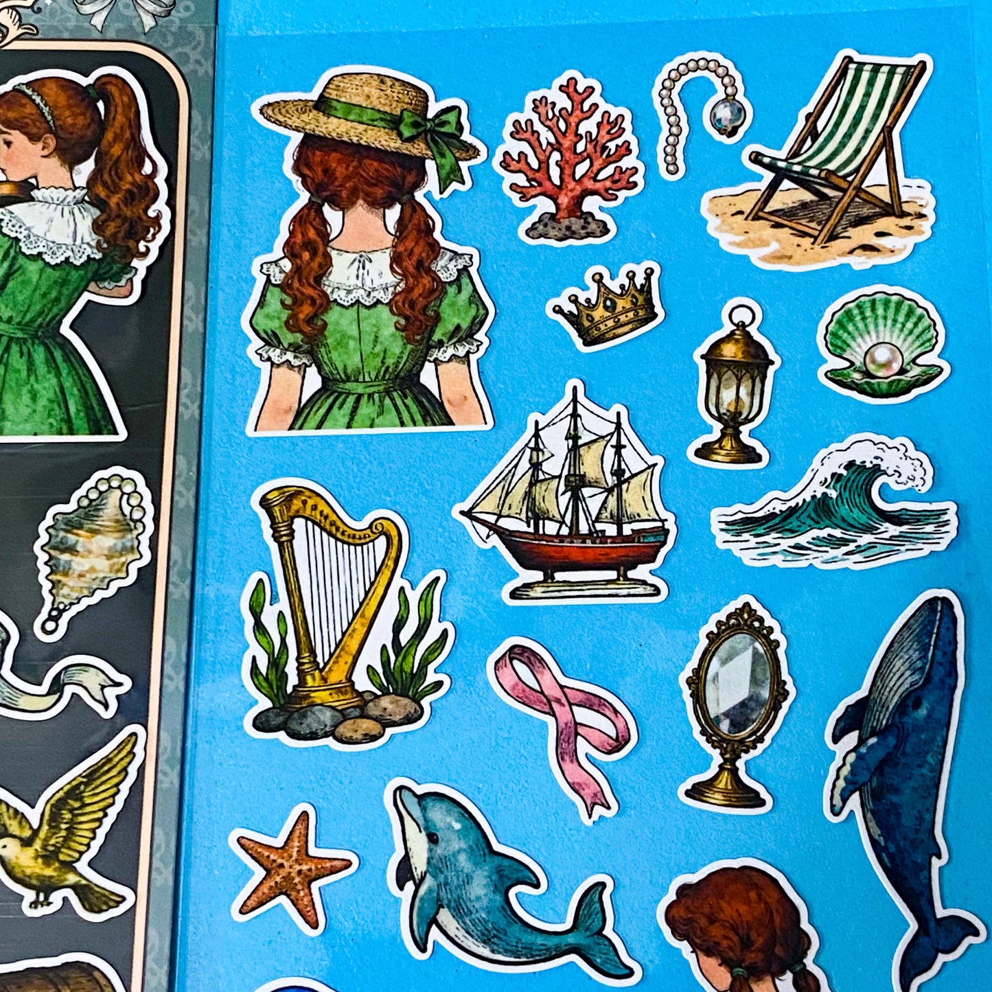 mermaid's secret cove little mermaid matte sticker pack with 2 decorative sheets featuring elegant mermaids, dolphins, whales, jellyfish, turtles, sailing ships, pearls, seashells and vintage ocean inspired illustrations Uk stationery shop.
