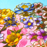 assorted large gold foil floral stickers on a turquoise and pink background