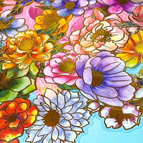 assorted large gold foil floral stickers on a turquoise background