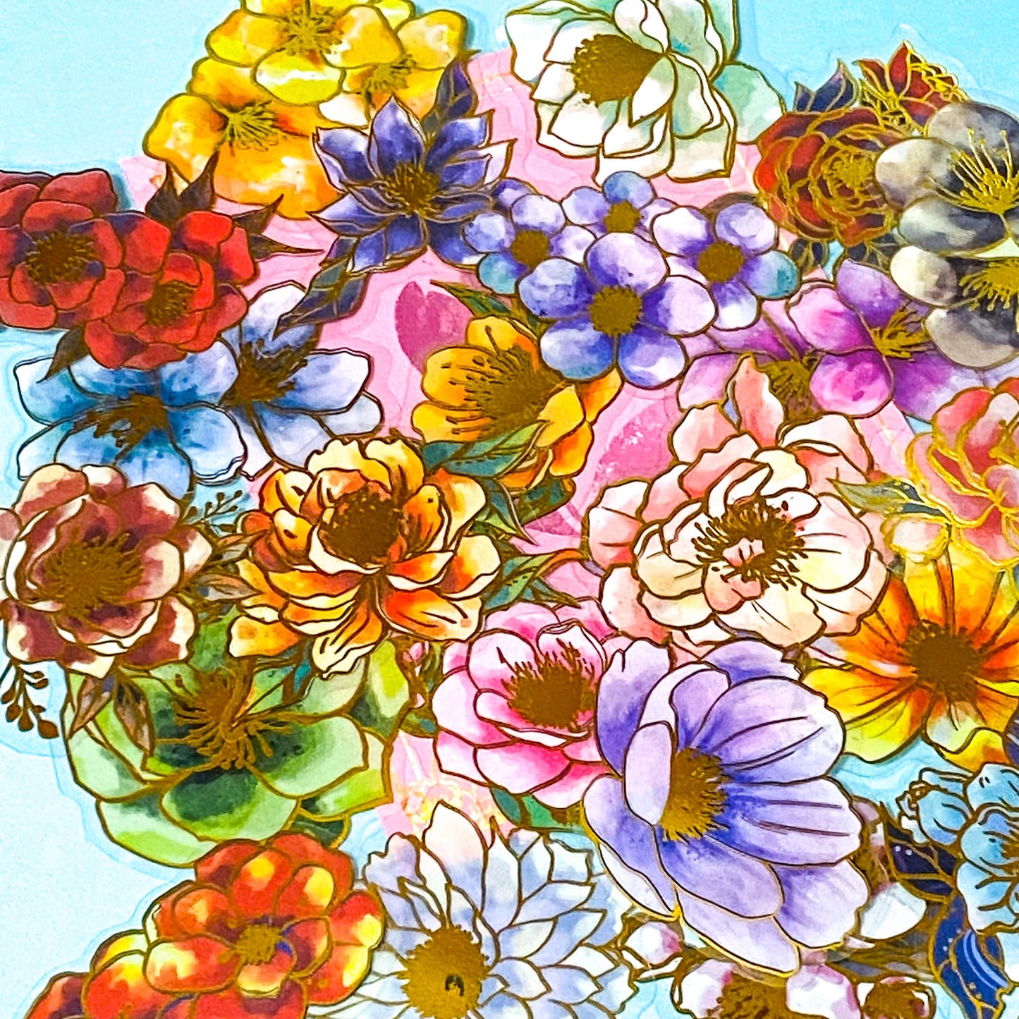 assorted large gold foil floral stickers on a turquoise and pink background