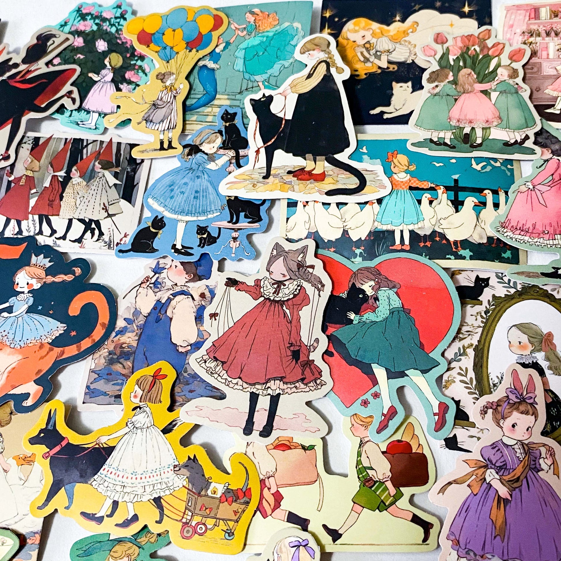 set of 50 vintage storybook style matte stickers featuring children, whimsical animals, cats and illustrated scenes in soft pastel and jewel tones for laptops and journaling